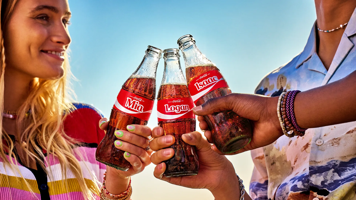 An image of Coca-Cola bottles with names